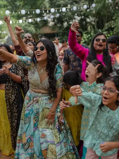 The energy of the baraat and pre-wedding festivities is infectious. We capture the couple and their friends dancing, playing games, and celebrating with pure, uninhibited joy.