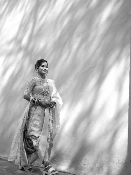 A timeless black and white shot that emphasizes the classic elegance and structure of the Nauvari drape.