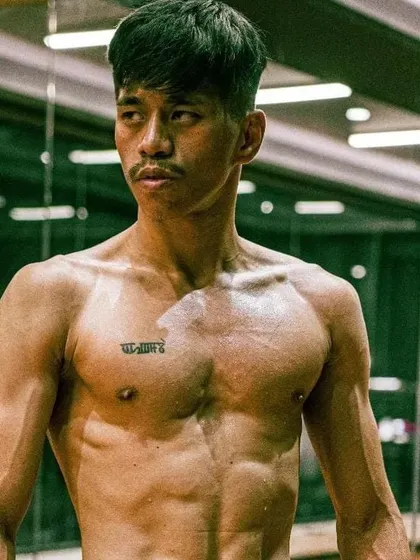 A portrait of instructor Avilash. His dedication to the striking arts is evident in his physique and focus. He leads our weekend striking classes, coaching students on everything from basic punches to advanced fight strategy.