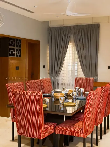 Part of our color series, this dining room uses bold red striped chairs to add a vibrant and energetic feel to the space.