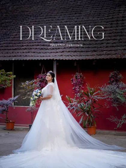 A breathtaking portrait of the bride, her long veil trailing behind her, creating a dreamy and dramatic effect.