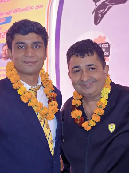 With a fellow coach and guest at a championship event.