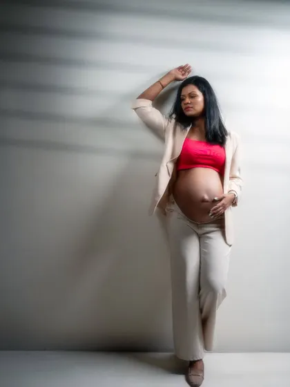 A portrait that speaks of power, grace, and resilience. This mom-to-be's strong pose and confident gaze tell a story of strength and individuality.