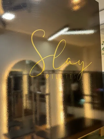 Our studio is your space to build strength, flexibility, and balance. The reflection in our sign shows the endless possibilities waiting for you on the reformer.