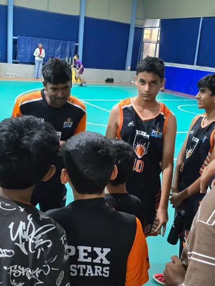 Post-match wisdom. A coach providing feedback and encouragement to his team right after a game. These moments are crucial for learning.