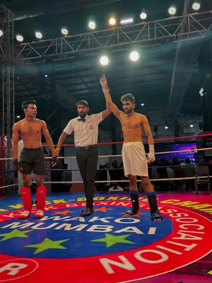 That winning feeling. My student's hand is raised by the referee after a dominant performance in his kickboxing bout.