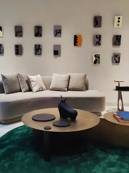 This installation for a residence in Hyderabad features a collection of small, individual 3D panels. Each panel is a miniature abstract artwork, and together they form a larger, cohesive composition that adds texture and personality to the living space.