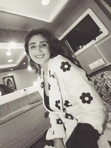 A charming black and white shot from behind the scenes. Her happy expression shows the fun we have during our styling sessions.