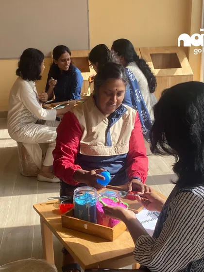 Participants in our Reggio Emilia workshop explore different materials and textures. This hands-on approach for educators and parents mirrors the student-centered, exploratory learning I champion for children.
