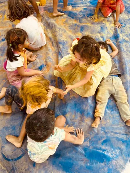 A beautiful, candid moment of play during our Holi festival. These are the moments of pure childhood joy that we strive to create every day.