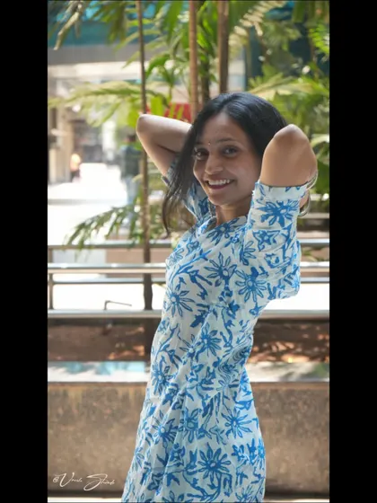 This pose is relaxed and natural. My aim is to capture your personality, and sometimes the best shots come from these simple, unforced moments.