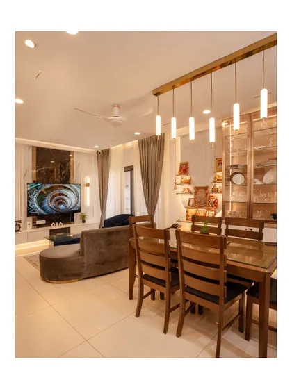 A complete view of a living and dining area at Sobha Royal Pavilion. The space is unified by elegant lighting and a consistent color palette, creating a luxurious and cohesive home.