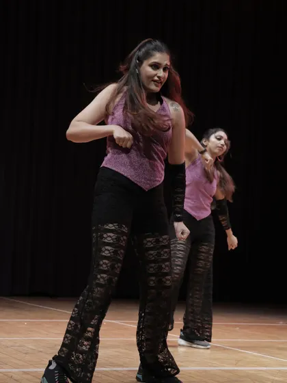 The power of a group performance. Our dancers learn to move as one, creating a stunning visual impact on stage.
