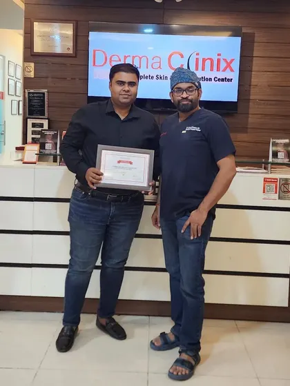 Dr. Kavish Chouhan with Dr. Akash, congratulating him on completing his hair transplant training with us.