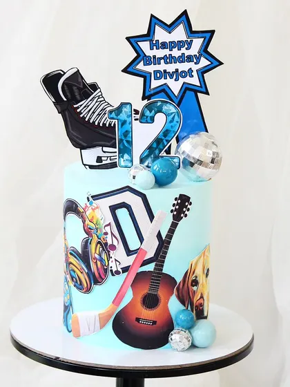 A personalized cake that combines a love for ice hockey, music, and pets. This design uses edible prints of a guitar and a dog, along with fondant details like a hockey stick and skates, to celebrate a 12th birthday.