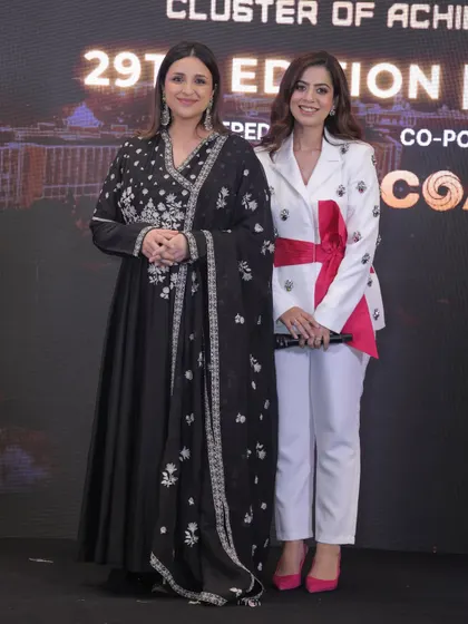 On stage with actress Parineeti Chopra for a COA event. Sharing the stage with celebrities requires a professional yet warm presence, ensuring they feel welcome and the event flows smoothly.