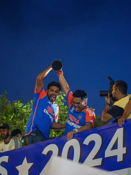 A photo series from the victory parade, capturing the Indian cricket team celebrating with the trophy on an open-top bus at Marine Drive. The images are filled with the joy and pride of the players and fans.