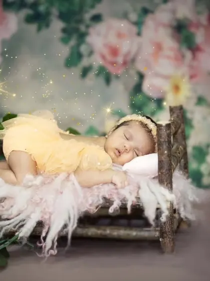 Another angle of this peaceful newborn, showcasing the delicate details of the setup. I carefully craft each scene to be as beautiful as the baby in it.
