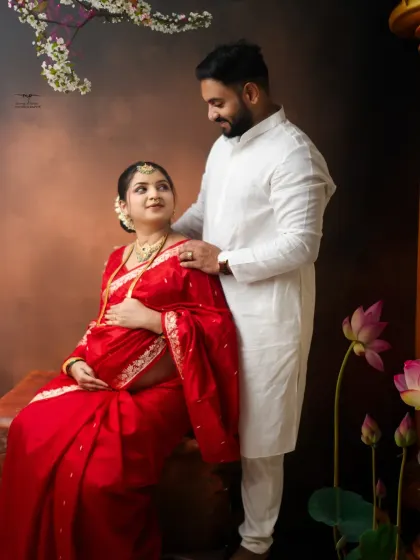 Sharing a look of love and excitement. This pose captures the beautiful connection between the couple during their traditional fine art maternity session.