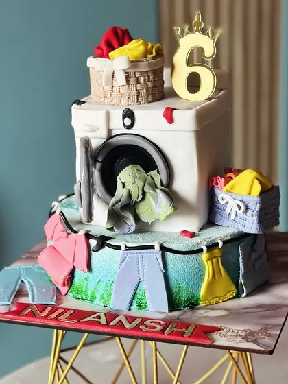 Who knew laundry could be this sweet? This unique washing machine cake, complete with tiny clothes and laundry baskets, was a fun and quirky creation for a 6th birthday.
