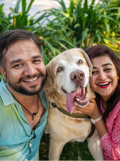 A happy portrait of Kumo and his parents. The joy on all their faces is a testament to the love they share.