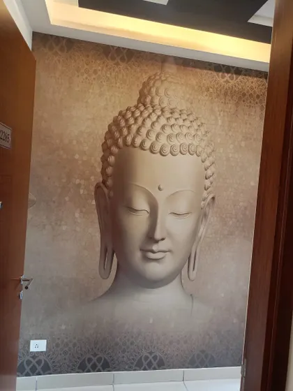 A serene 3D-effect Buddha mural installed in a living area. This type of custom wallpaper adds a peaceful and spiritual focal point to the room, and I make sure the placement is centered for maximum impact.