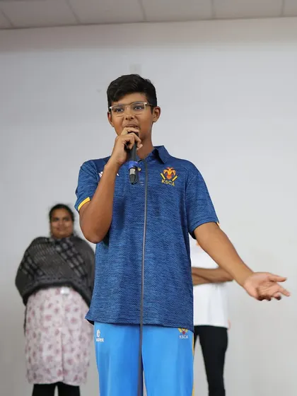 Our star cricketer, Tanshh Krishna, addresses his peers during a felicitation program celebrating his selection to the state team.