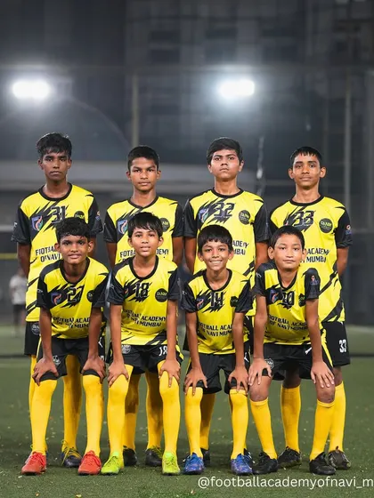 The team that trains together, wins together. A group photo of one of our youth teams after a tough training session under the lights.