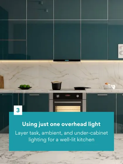 Don't make the mistake of using just one overhead light. We layer task, ambient, and under-cabinet lighting to create a well-lit and inviting kitchen, like this one with teal cabinets.