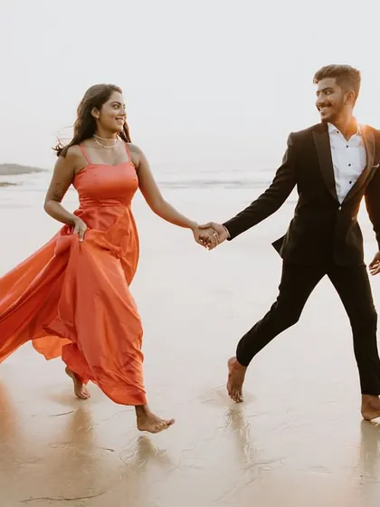 A fun and candid moment from a beach pre-wedding shoot. I offer a variety of gowns and matching suits to create the perfect look for your photos.