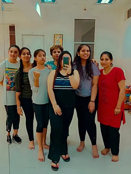 Posing together after class. It's not just about dance; it's about creating a supportive and fun environment for everyone.