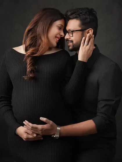 This color version of an intimate couple's portrait showcases the warmth and connection between them. The soft lighting highlights their expressions and the gentle embrace.