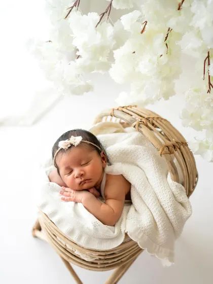 Another angle of the rattan bassinet setup, showing the beautiful textures and the peacefulness of the moment.