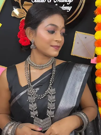 A close-up of the festive makeup for Makar Sankranti, with soft, shimmering eyes and a natural lip color.