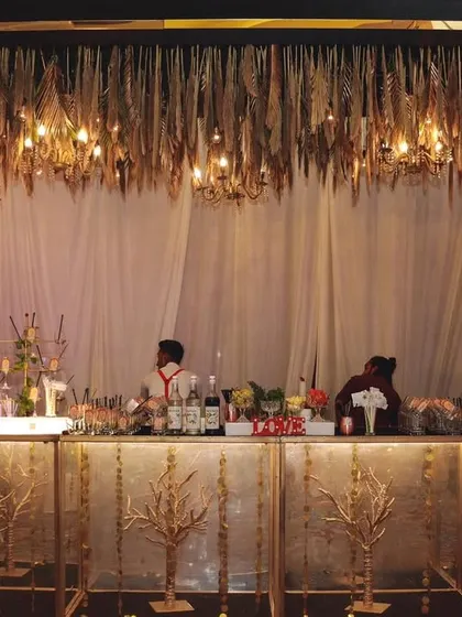 A bar should be more than just a counter; it should be a masterpiece. I design and execute stunning, luxurious bar setups like this one, complete with elegant decor and professional service to match the grandeur of your wedding.