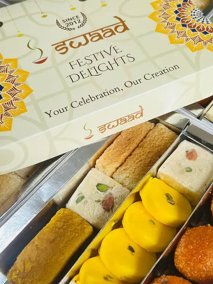This is our signature 'Festive Delights' box, which can be fully customized with your company logo and branding. It’s a professional and attractive packaging solution for all your corporate gifting requirements.