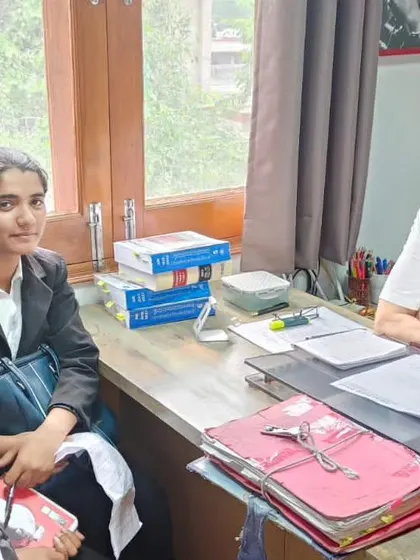 In my office with law interns, surrounded by case files. It is crucial to train young lawyers in social justice law and show them how to use their skills to defend the rights of the exploited.