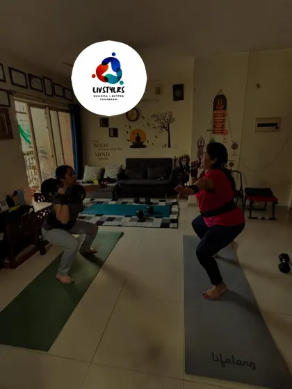 Two clients perform goblet squats, a full-body exercise that is particularly effective for women looking to build functional strength and improve posture.