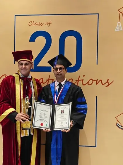 Our leadership's expertise is at the core of our educational quality. Here, our founder, Vinit Kumar, is seen receiving an Honorary Doctorate Degree from Washington Digital University, USA, for his exceptional contributions to the arts.