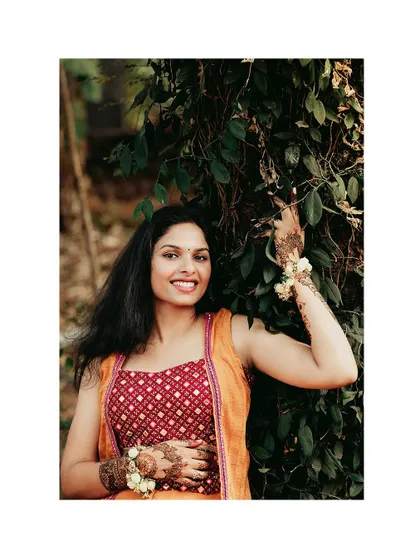 A lovely portrait of the bride in her Haldi outfit, her smile radiant.