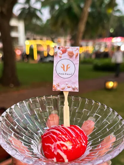 A delightful dessert ball, coated in red and drizzled with white chocolate, served in a crystal bowl. This was a special treat for a beautiful outdoor wedding in Goa.