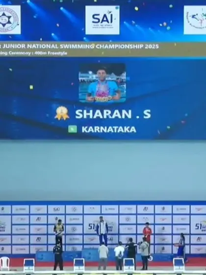 A wide shot of the podium ceremony for Sharan S's victory.