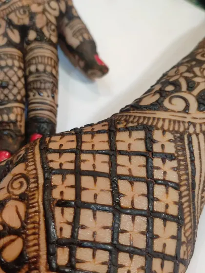 A macro shot of the checkered pattern, showing the precision and control needed for clean gridwork.