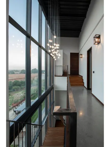 This is a duplicate of ID 75. A view from the upper-level corridor, looking down into the main living area.