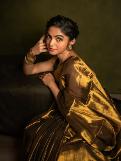 This is the essence of my painterly style. I use light and shadow to craft a portrait that feels timeless, capturing the quiet strength and grace of the woman in the frame. This image, with its rich golden tones and classic composition, is more than a photo; it's a piece of art celebrating her story.