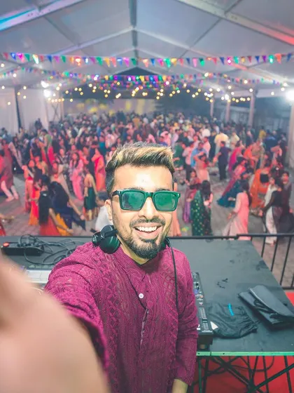 A quick selfie from the DJ console during a massive Dandiya night. I love the energy of festive events, blending traditional Garba tracks with high-energy Bollywood music to keep everyone dancing.