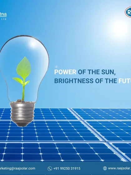 The power of the sun brings brightness to the future. This image of a plant growing inside a lightbulb powered by solar panels symbolizes the life and growth that sustainable energy fosters.