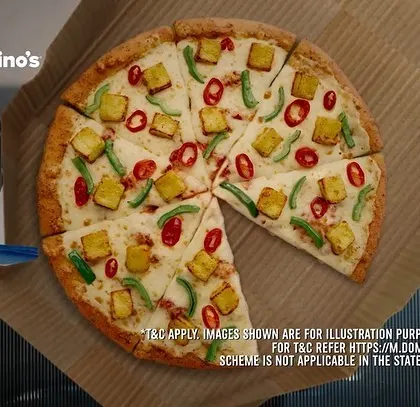 A top-down view of the Domino's pizza, a key product shot from the commercial.