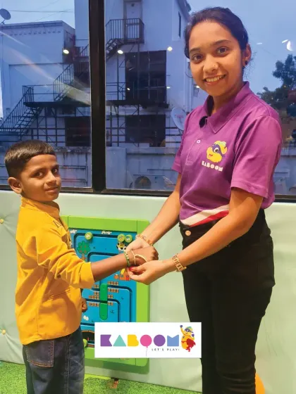 Celebrating the bond of love. One of our team members ties a Rakhi onto a young boy's wrist, marking a special moment during our Rakshabandhan event.
