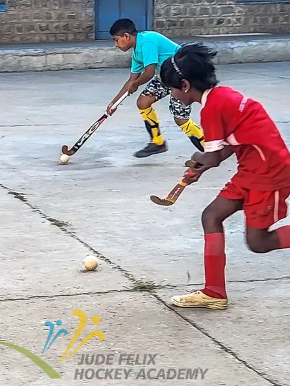 Two players from our 2024 camp race for the ball, showing the competitive spirit we nurture in a friendly environment.